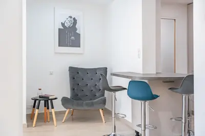 Coin salon dans l'établissement 3 pièces rénové en bord de mer - Terrasse