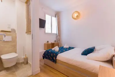 Un ou plusieurs lits dans un hébergement de l'établissement Azur Loft Beauséjour Heart of Cannes