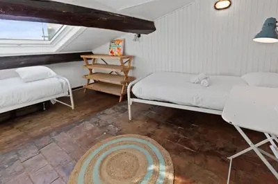 Un ou plusieurs lits dans un hébergement de l'établissement Le Picasso - Hypercentre - Duplex - Rooftop - Clim - Escaliers