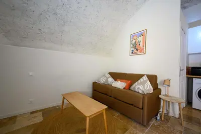 Coin salon dans l'établissement LX233 Studio voûté cœur du village - Charme absolu