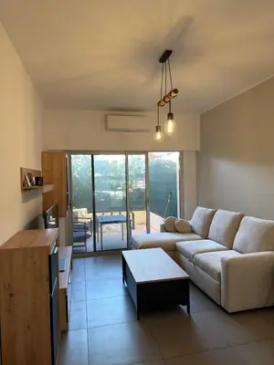 Coin salon dans l'établissement Superbe Appartement 2 pièces - 39m2