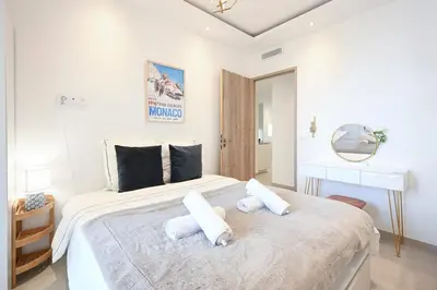 Un ou plusieurs lits dans un hébergement de l'établissement Two bedrooms with view over the sea