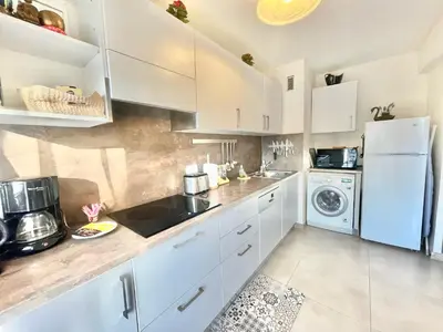 Cuisine ou kitchenette dans l'établissement Arènes by Welcome to Cannes