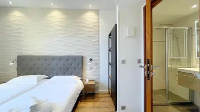 Un ou plusieurs lits dans un hébergement de l'établissement Hotel Le Florian
