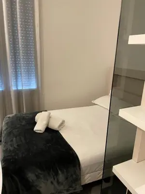 Un ou plusieurs lits dans un hébergement de l'établissement Hôtel Anna Livia