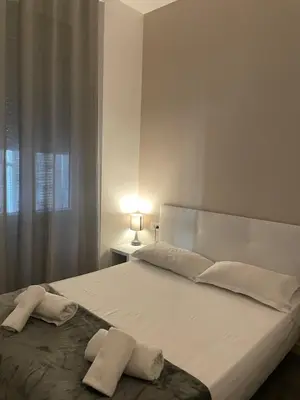Un ou plusieurs lits dans un hébergement de l'établissement Hôtel Anna Livia
