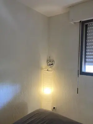 Un ou plusieurs lits dans un hébergement de l'établissement Zen Attitude Apartment
