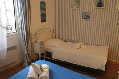 Un ou plusieurs lits dans un hébergement de l'établissement Viva Riviera - 5 Rue Commandant André