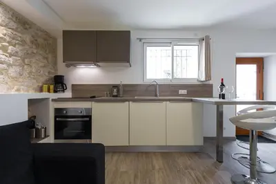 Cuisine ou kitchenette dans l'établissement Cosy Home