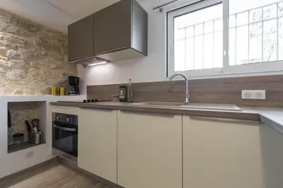 Cuisine ou kitchenette dans l'établissement Cosy Home