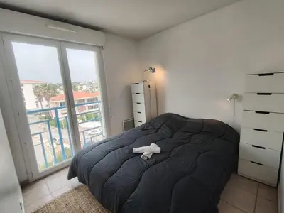 Un ou plusieurs lits dans un hébergement de l'établissement Apartment Le Grand Large by Interhome