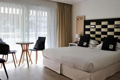Un ou plusieurs lits dans un hébergement de l'établissement Hôtel Victoria