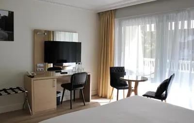 Télévision ou salle de divertissement dans l'établissement Hôtel Victoria