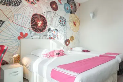 Un ou plusieurs lits dans un hébergement de l'établissement Hôtel de charme CECIL