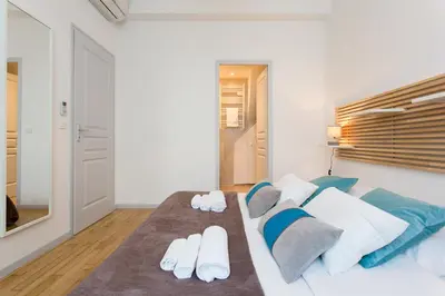 Un ou plusieurs lits dans un hébergement de l'établissement Teisseire Accomodations