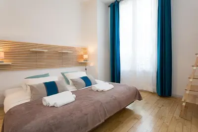 Un ou plusieurs lits dans un hébergement de l'établissement Teisseire Accomodations