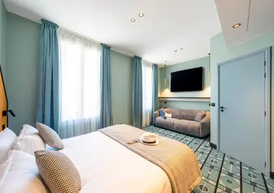 Un ou plusieurs lits dans un hébergement de l'établissement Hôtel CASA MOHO - Juan-Les-Pins