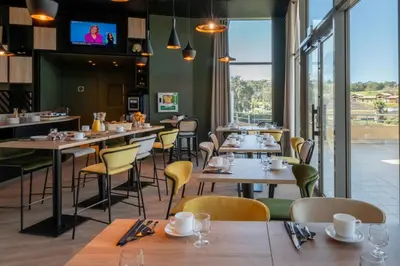 Restaurant ou autre lieu de restauration dans l'établissement Nemea Appart Hotel Green Side Biot Sophia Antipolis