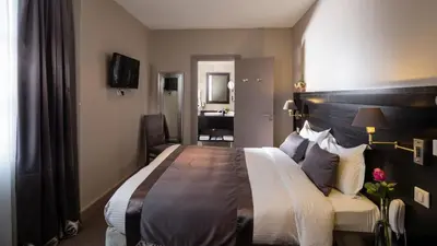 Un ou plusieurs lits dans un hébergement de l'établissement La Place Boutique Hotel