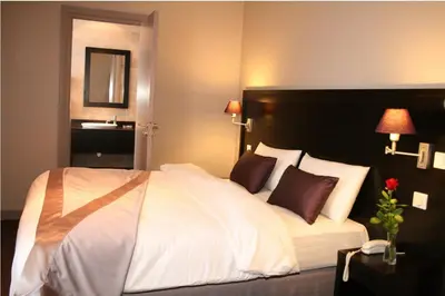 Un ou plusieurs lits dans un hébergement de l'établissement La Place Boutique Hotel