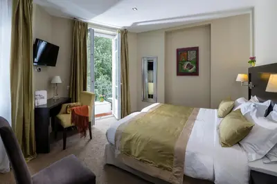 Un ou plusieurs lits dans un hébergement de l'établissement La Place Boutique Hotel