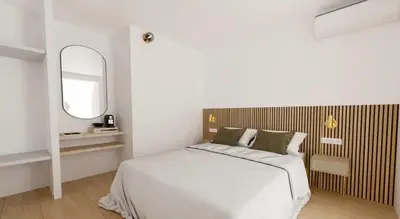 Un ou plusieurs lits dans un hébergement de l'établissement Hotel le Romanesque