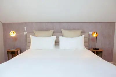 Un ou plusieurs lits dans un hébergement de l'établissement Boutique Hôtel Villa Fabulite