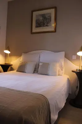 Un ou plusieurs lits dans un hébergement de l'établissement Hôtel La Villa des Oliviers
