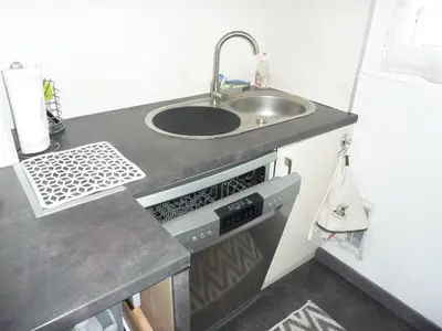 Cuisine ou kitchenette dans l'établissement Le Tanagra