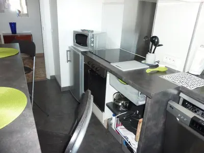 Cuisine ou kitchenette dans l'établissement Le Tanagra
