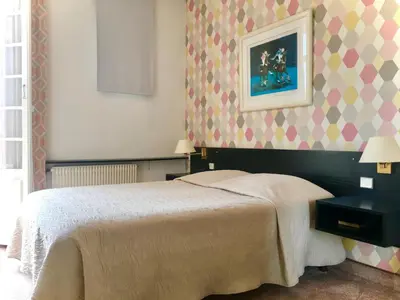 Un ou plusieurs lits dans un hébergement de l'établissement Hotel des Mimosas