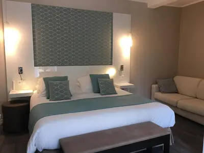 Un ou plusieurs lits dans un hébergement de l'établissement Hotel Molière