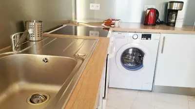 Cuisine ou kitchenette dans l'établissement Le De Gaulle
