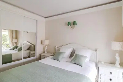 Un ou plusieurs lits dans un hébergement de l'établissement Appartement CANNES IMPERIAL Pointe Croisette