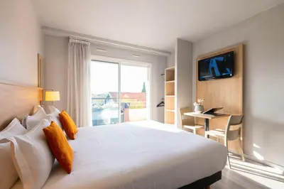 Un ou plusieurs lits dans un hébergement de l'établissement Zenitude Hôtel-Résidences Le Cannet