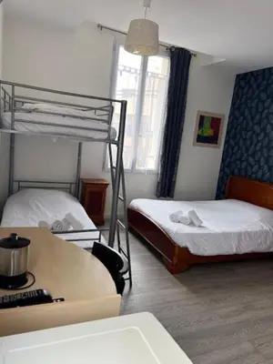 Un ou plusieurs lits dans un hébergement de l'établissement Hôtel Trianon