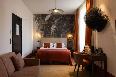 Un ou plusieurs lits dans un hébergement de l'établissement Hotel Verlaine