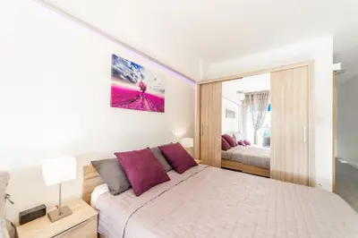 Un ou plusieurs lits dans un hébergement de l'établissement L'Ascot Appartement, plages à 300m, vue hippodrome
