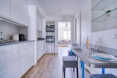 Cuisine ou kitchenette dans l'établissement Le Marignan