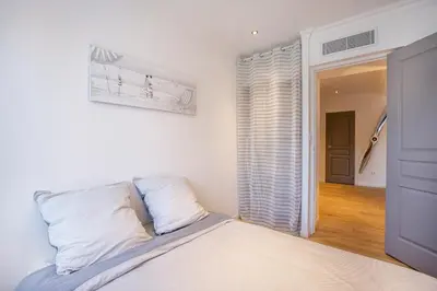 Un ou plusieurs lits dans un hébergement de l'établissement 3 pièces Luxe Croisette