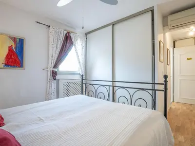 Un ou plusieurs lits dans un hébergement de l'établissement Apartment Le Mandarin by Interhome