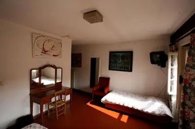 Un ou plusieurs lits dans un hébergement de l'établissement Hôtel Les Arcades