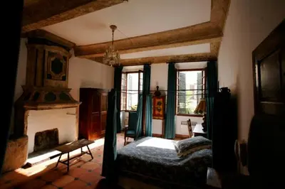 Un ou plusieurs lits dans un hébergement de l'établissement Hôtel Les Arcades