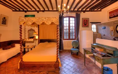 Un ou plusieurs lits dans un hébergement de l'établissement Hôtel Les Arcades