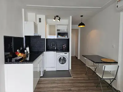 Cuisine ou kitchenette dans l'établissement Le Soleil
