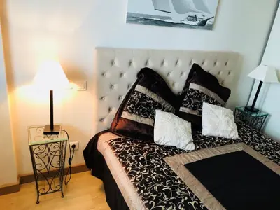 Un ou plusieurs lits dans un hébergement de l'établissement Ô Palais des Iles Two Bedroom Cannes