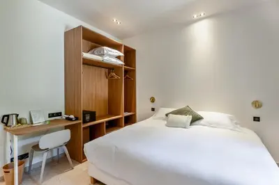 Un ou plusieurs lits dans un hébergement de l'établissement La Garoupe-Gardiole Boutique Hotel