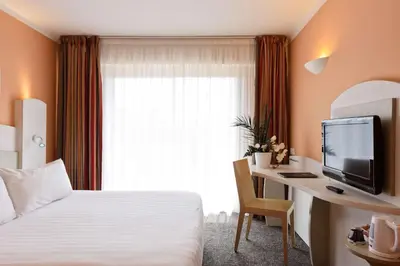 Un ou plusieurs lits dans un hébergement de l'établissement Best Western Astoria