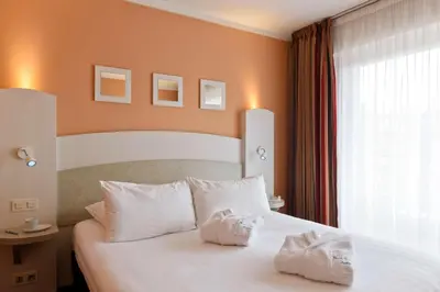 Un ou plusieurs lits dans un hébergement de l'établissement Best Western Astoria