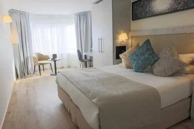 Un ou plusieurs lits dans un hébergement de l'établissement Eden Hotel & Spa